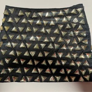 Bejeweled black Bebe miniskirt size 0. NWOT